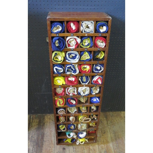 944 - A Maritime Teak Cased Signal Flag Organizer with 44 flags, 91x31cm. Some damage to case