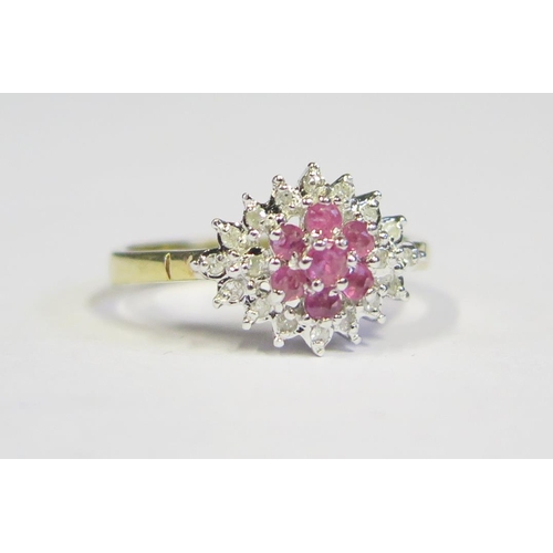 86 - A 9ct Gold, Ruby and Diamond Cluster Ring, size M.5, 2.7g