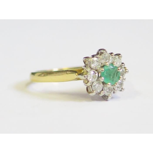 303 - An 18ct Gold, Emerald and Diamond Ring, size L.5, 3.2g