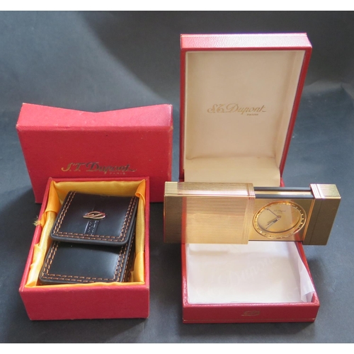 573 - A Cased SJ Dupont Gold Plated Travel Alarm and leather sleeve