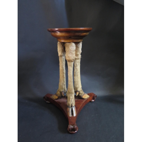 1379 - An Occasional Table raised on three cloven hoof legs, 53cm high