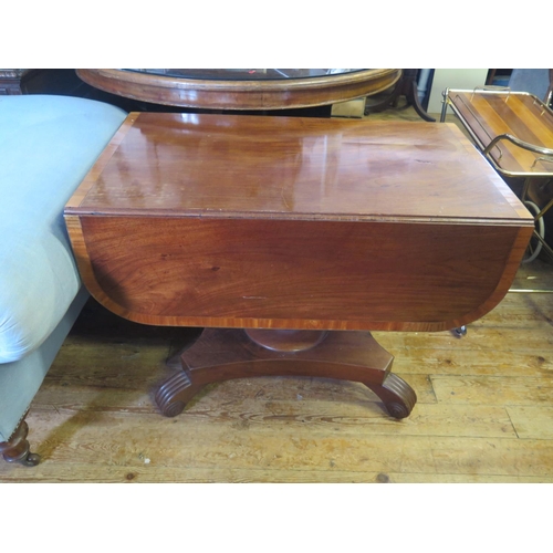 1405 - A 19th century Mahogany and Crossbanded Pembroke Table on turned pedestal with reeded scrolling quad... 