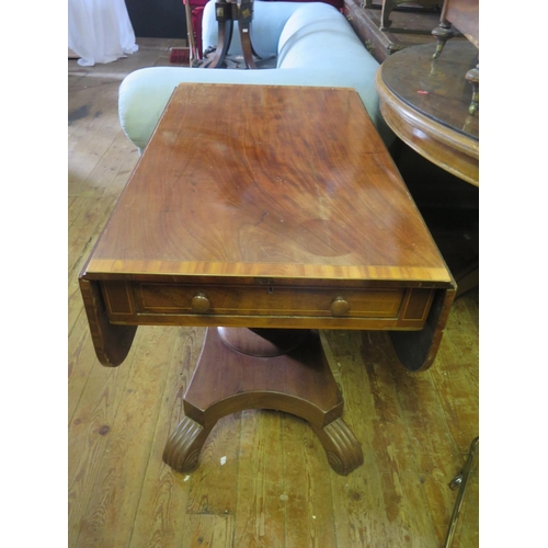 1405 - A 19th century Mahogany and Crossbanded Pembroke Table on turned pedestal with reeded scrolling quad... 