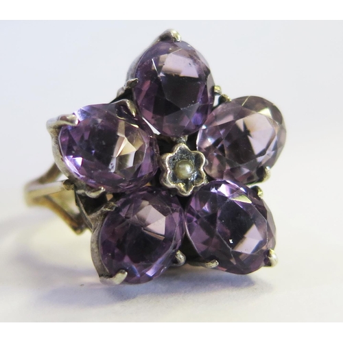 177 - A 9ct Gold, Amethyst and Pearl Flower Head Ring, size J.5, 6.7g