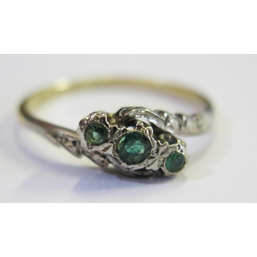 179 - An 18ct Yellow Gold and Emerald Three Stone Ring, size P.5, 2.6g