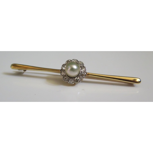 241 - A Pearl and Diamond Bar Brooch in an unmarked high carat gold setting, 12mm head, 60mm wide, 5g