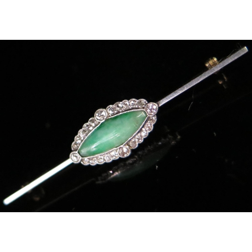 249 - A Diamond and Jadeite Brooch in an unmarked white and yellow gold setting, 55mm, 3.9g