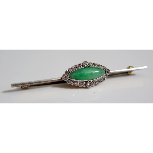 249 - A Diamond and Jadeite Brooch in an unmarked white and yellow gold setting, 55mm, 3.9g