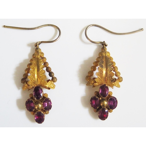 253 - A Pair of Antique Garnet Set Pendant Earrings in unmarked gold settings, 30mm drop, 2.6g