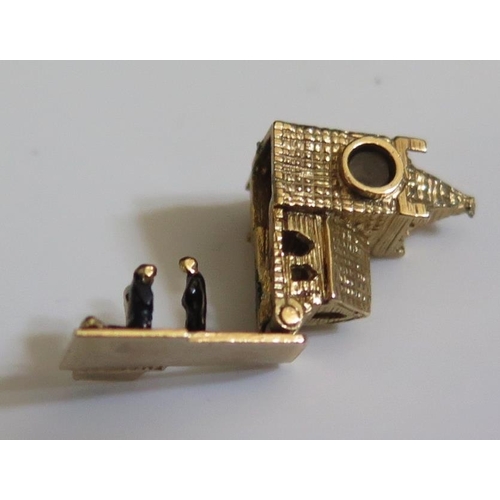 257 - A 9ct London Gold Charm in the form of a church with hinge opening to reveal three enamelled figures... 