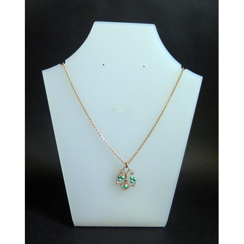 259 - An Unmarked 9ct Gold Necklace with turquoise mounted pendant, 5.6g