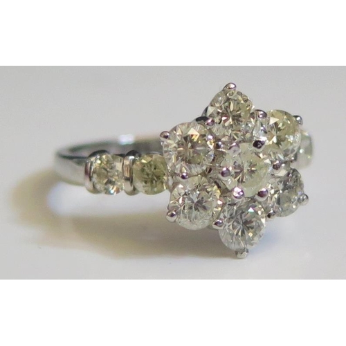 261 - A 2ct Diamond Floral Cluster Ring in a .950 platinum setting, 13mm head, size Q.5, 7g