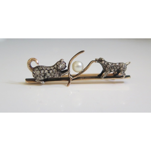 268 - A Victorian Rose Cut Diamond and Pearl Mounted Brooch in the form of a cat and dog pulling on a wish... 