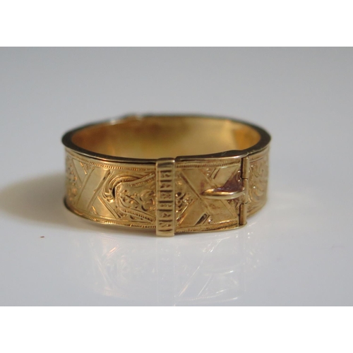 313 - An Early 19th Century High Carat Gold Memorial Buckle Ring with twin hinges opening to a band of wov... 