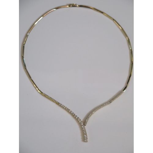 321 - A 14K Gold and Diamond Necklace set with 59 stones, largest 3.5mm, 17.1g