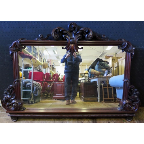 1464 - A Victorian Carved Mahogany Overmantle Mirror with foliate scroll decoration, 181(w)x127(h)cm