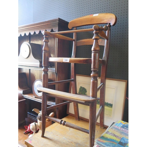 1499 - A Victorian Mahogany Cane Seated Child's High Chair. Old worm to arm