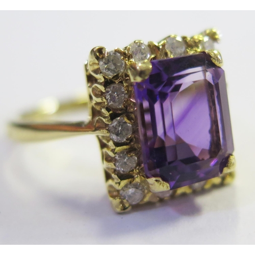 172 - An 18ct Gold, Amethyst and Diamond Ring, size L.5, 5.3g