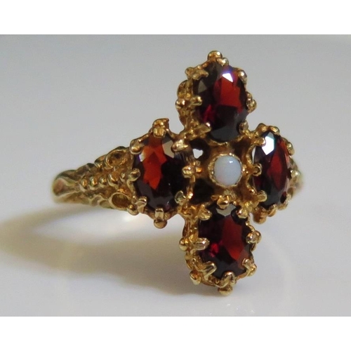 193 - A 9ct Yellow Gold, Garnet and Opal Ring, size S, 4.6g