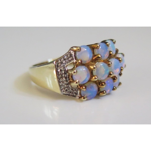 229 - A 9ct Gold, Opal and Diamond Ring, size N.5, 4.2g