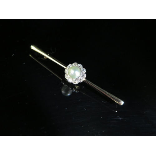 241 - A Pearl and Diamond Bar Brooch in an unmarked high carat gold setting, 12mm head, 60mm wide, 5g