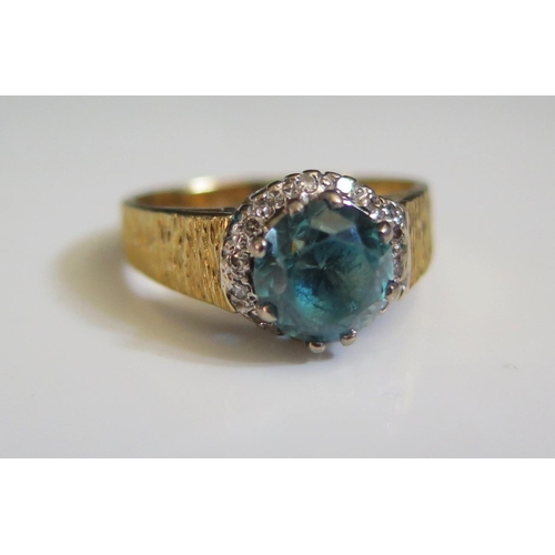 245 - An 18ct Gold, Zircon and Diamond Ring, size Q.5, 6.1g, zircon c. 8mm