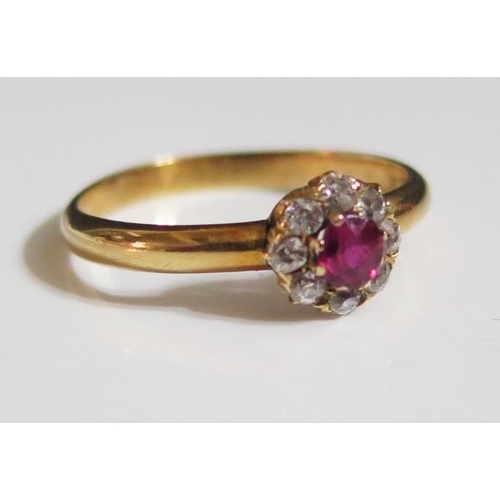 275 - An 18ct Gold, Ruby and Diamond Cluster Ring, 7mm head, 3.5mm ruby, size N, 2.3g