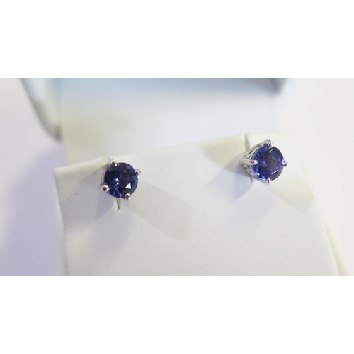 302 - A Pair of 18ct White Gold and Tanzanite Stud Earrings, 1.4g, stones 5mm