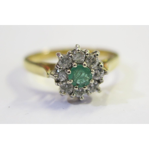 303 - An 18ct Gold, Emerald and Diamond Ring, size L.5, 3.2g