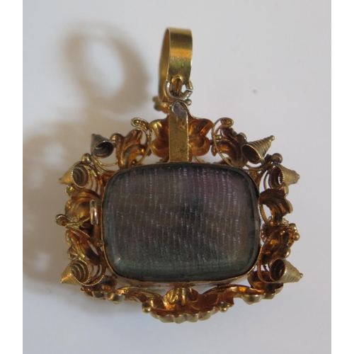 312 - A Victorian Memorial Pendant Brooch in an unmarked high carat gold setting, glazed panel to the back... 