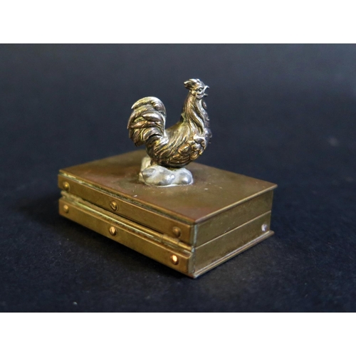 546B - A Finely Made 19th Century Hinged Brass Box with white metal cockerel finial, 39x27mm