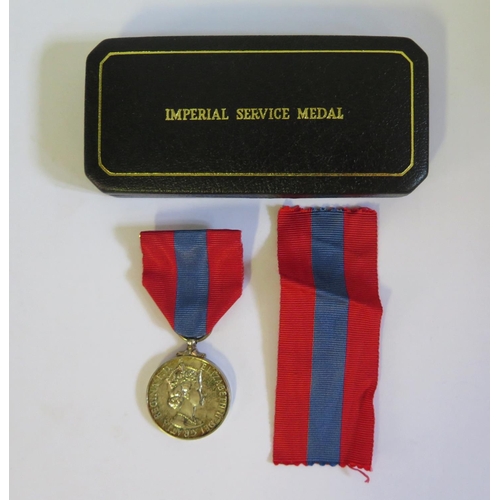 562 - A Cased Faithful Service Medal awarded to Miss Betty Alice McLarin