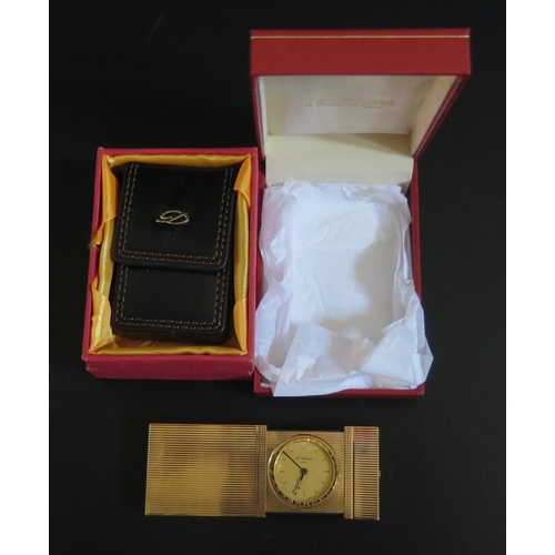 573 - A Cased SJ Dupont Gold Plated Travel Alarm and leather sleeve