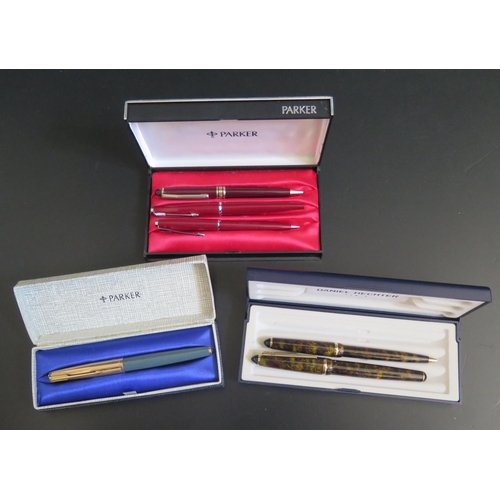 577 - A Boxed Parker Fountain Pen with rolled gold lid, one other Parker fountain pen and matching pencil ... 