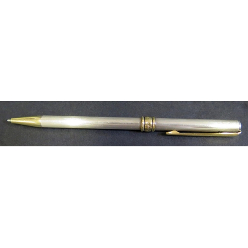 581 - A Cartier Silver and Gilt Ballpoint Pen