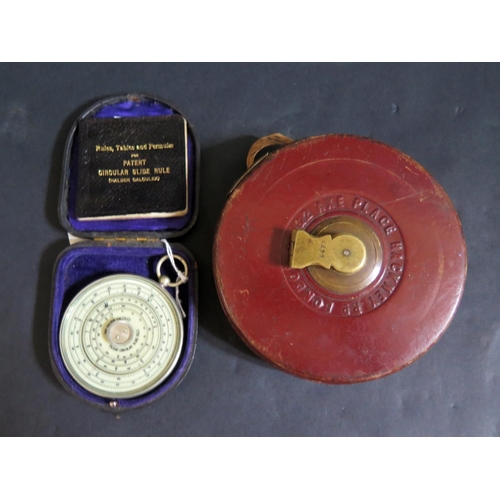 599 - A Cased Haldon Calculex and Davies Patent tape measure