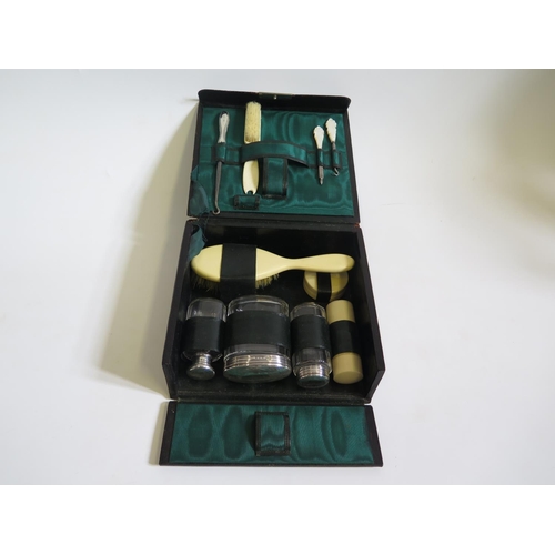 617 - An Edward VII Leather Toiletry Travelling Case fitted with three Birmingham silver top cut glass bot... 