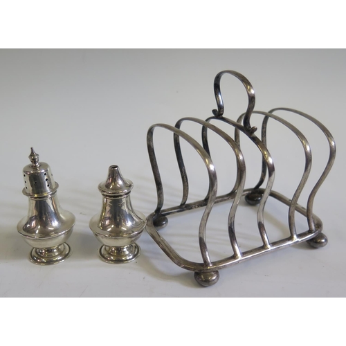 639 - A London Silver Toast Rack A/F and Birmingham 1918, silver pepper and salt 153g.