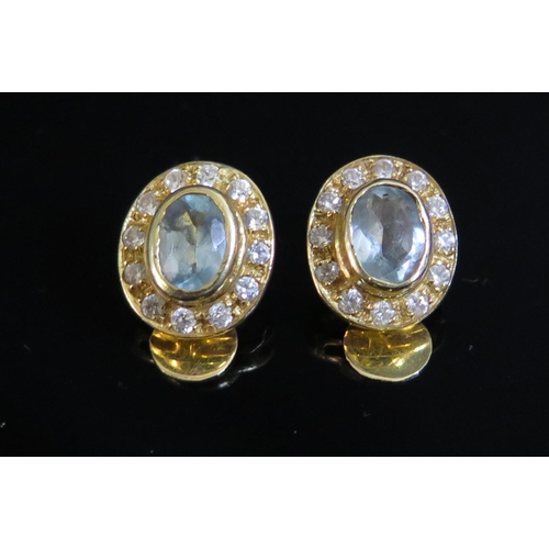 71 - A Pair of .585 (14ct) Yellow Gold, Blue Topaz and White Stone Clipon Earrings (13x11mm), 4.8g