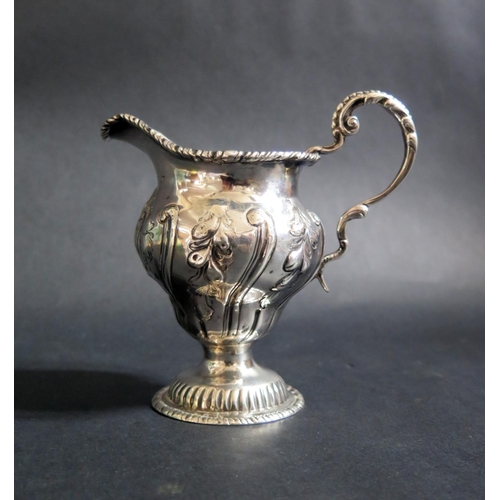 730 - A George III Silver Cream Jug with embossed foliate decoration, London 1767, C.C, 124g