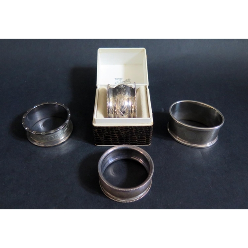 739 - Three Birmingham Silver and one Chester Silver Napkin Rings, one engraved Alma and boxed, 69g