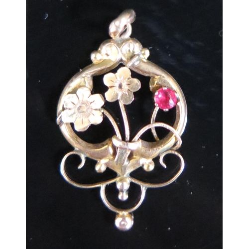 74 - A 9ct Yellow Gold and Red Stone Set Floral Pendant, H&W, 29mm drop, 0.8g