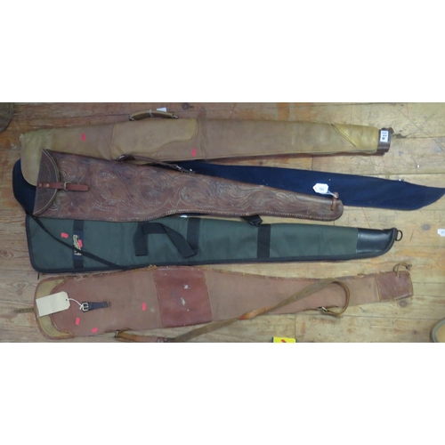 762 - An American Tooled Leather Rifle Case (c. 106cm long), R. MacLeod & Sons soft case and others