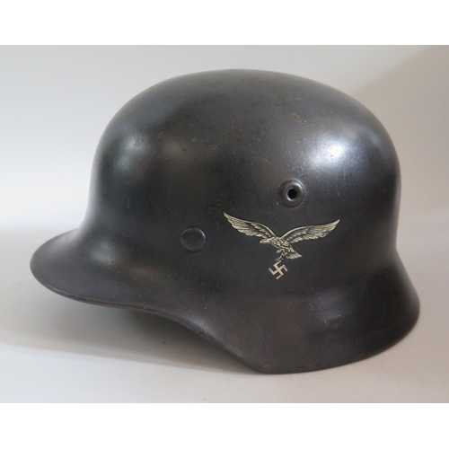 771 - A WWII German Luftwaffe Helmet with single decal, stamped Q64 and original leather liner