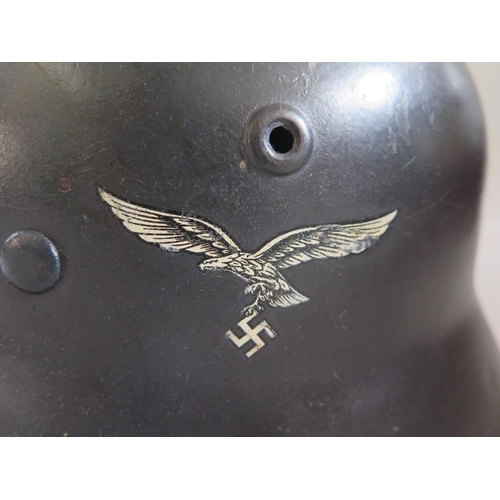 771 - A WWII German Luftwaffe Helmet with single decal, stamped Q64 and original leather liner