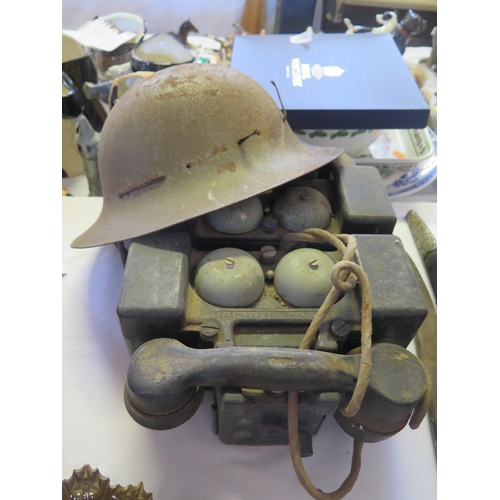 793 - A Pair of Military Mk. II Field Telephones and Brodie helmet