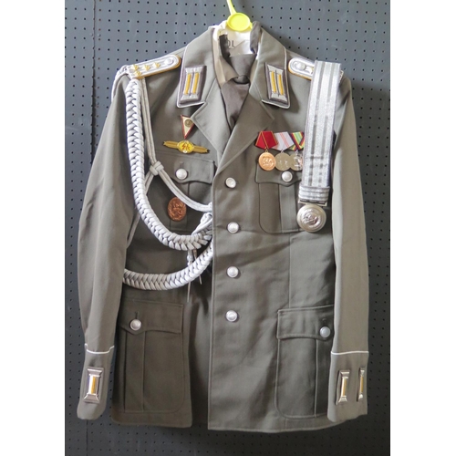 797K - A G.D.R. Army Uniform, complete with tunic, shirt, tie, trousers, cap, gloves, belt and boots