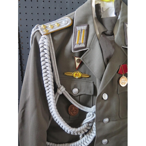 797K - A G.D.R. Army Uniform, complete with tunic, shirt, tie, trousers, cap, gloves, belt and boots