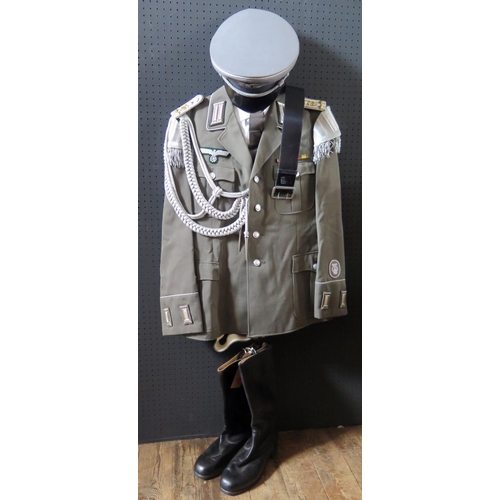 797M - A G.D.R. Army Uniform, complete with tunic, shirt, tie, trousers, cap, belt and boots