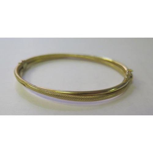 279 - A 9ct Gold Hinged Bangle,  5.2g